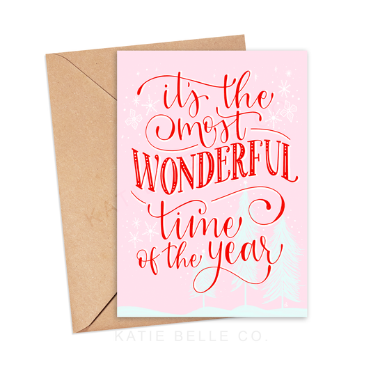 Its the most wonderful time of the year. Greeting  card. christmas card. Holiday cards. Seasons greetings. holiday wishes. Pink christmas. A2 size. vertical design. Red hand lettered scrip. Made by katie belle co. 